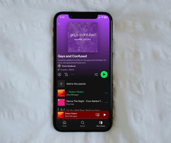 iPhone with a Spotify playlist on the screen
